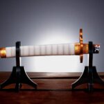 Descubre el apasionante mundo de Replica Espada Nichirin rota Kyojuro Rengoku.