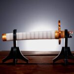 Descubre el apasionante mundo de Replica Espada Nichirin rota Kyojuro Rengoku.