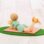 Descubre el apasionante mundo de Estatua Yumi Aiba off stage.